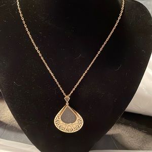 Long gold coloured chain pendent by Maurices. NWT